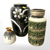 Two West German earthenware vases and a further porcelain vase, height 30 cm.