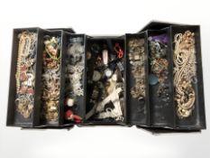 A modern fold out jewellery box containing large quantity of costume jewellery,