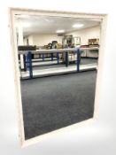 A reproduction bevelled mirror,