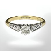 An 18ct gold and platinum diamond solitaire ring, size O.