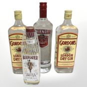A bottle of Smirnoff vodka, 1l, two bottles of Gordon's Special London dry gin,