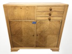 A 20th century Danish oak side cabinet, 131 cm x 45 cm x 126 cm.