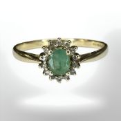 A 9ct gold emerald and diamond cluster ring, size U1/2 CONDITION REPORT: 2.