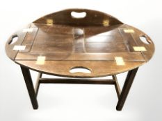 A mahogany butlers tray table on stand, width 68 cm.