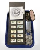 An album of WD and HO Wills cigarette cards all depicting dogs, a quantity of sixpence pieces,