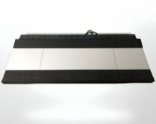 A Bang & Olufsen Beocenter 9300, with lead.