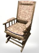 An early 20th century turned beech rocking chair