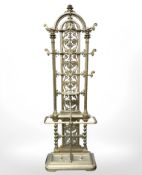 A Victorian gold painted cast iron hall stand with drip trays beneath,