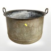 A 19th century patinated copper twin handled cooking pot, diameter 48 cm.