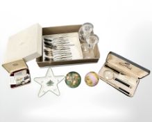 A Langham glass paperweight, together with two further glass paperweights,