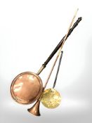A Victorian copper bed warming pan, brass roasting pan and a copper horn,