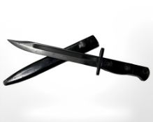 A British L1A3 SLR knife bayonet with bowie blade, stamped 1966 Enfield, in scabbard.