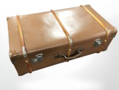 A reproduction faux leather luggage case, width 81 cm.