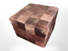 A 20th century leather cube footstool,