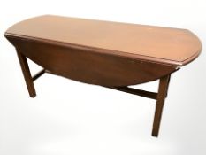 A mahogany drop leaf coffee table , length 127 cm.