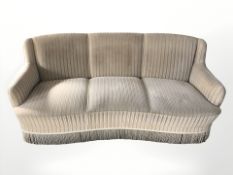 An early 20th century three seater settee,