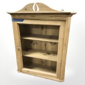 An early 20th century pine glazed single door wall cabinet, 70 cm x 29 cm x 86 cm.