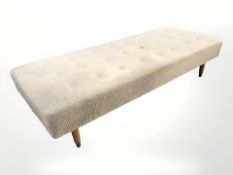 A 20th century Danish day bed in buttoned upholstery,