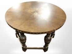 An early 20th century continental oak circular coffee table on bulbous legs, diameter 84 cm.
