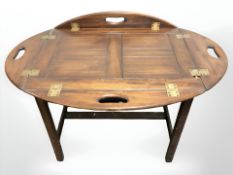 A mahogany butlers tray table, width 60 cm.