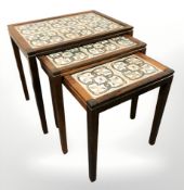 A nest of Danish tile inset tables, width 52 cm.
