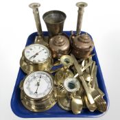 A quantity of brass cutlery, two pairs of candlesticks, two copper kettles,