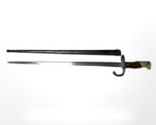 A French Gras Epee Modele 1874 bayonet with wood grips, in steel scabbard,