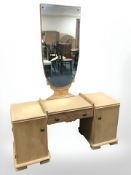 A continental pine mirror back dressing table in the Art Deco style, 125 cm x 42 cm x 165 cm.