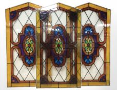Three contemporary leaded glass arched panels,
