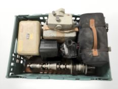 A Sony digital camcorder, Polaroid camera, surveyor's level and similar items.