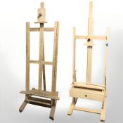Two adjustable easels, largest 192 cm high.