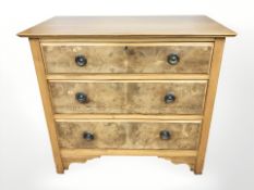 An Edwardian walnut three drawer chest,
