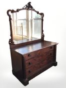 A Victorian mahogany and walnut three drawer mirror back chest,