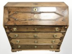 A 19th century inlaid oak bureau, 107 cm x 45 cm x 100 cm.