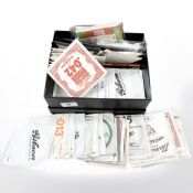 A box containing a quantity of guitar strings, Fender and Gibson branded etc.