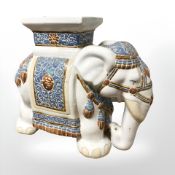 A ceramic elephant plant stand, height 44 cm.