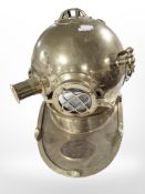A reproduction brass U.S Navy diving helmet.