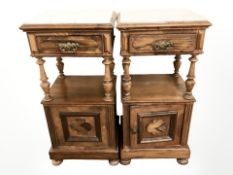 A pair of 19th century French walnut white marble topped bedside stands,