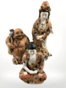 Three 20th Century Japanese export Satsuma earthenware figures, tallest 45 cm.