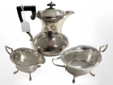 An EPNS three piece tea service, teapot 23 cm high.