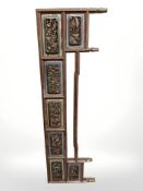 A Chinese carved lacquered and gilt panel, length 112 cm.