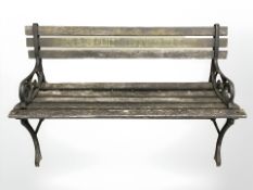 A cast iron and teak garden bench, length 122 cm.