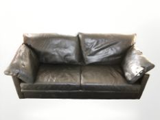 A contemporary Danish black leather three seater settee,