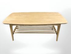 A contemporary Scandinavian oak coffee table with undershelf, 130 cm x 70 cm x 51 cm.