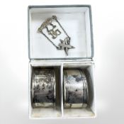A silver St Mary's Shrine Masonic medal, inscription verso, and a pair of silver napkin rings,