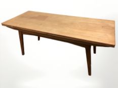A 20th century Danish teak pull-out extending coffee table, length 140 cm.