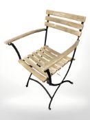 A metal and teak folding garden chair.
