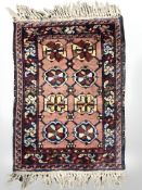 A small Iranian fringed mat, 70 cm x 43 cm.
