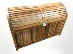 A 20th century teak domed blanket box, width 90 cm.