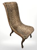A continental mahogany framed ladies chair in leopard print fabric.